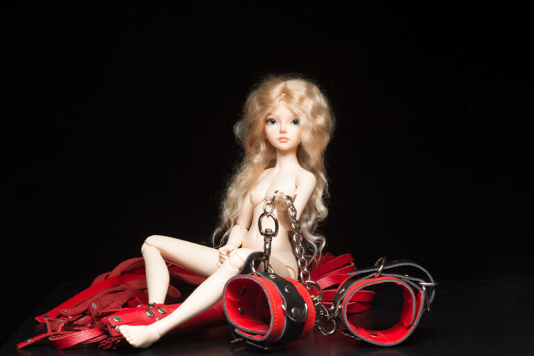 concept. doll with different sex toys.